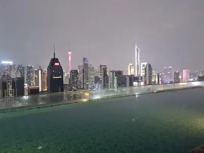 a view of a city skyline from a rooftop swimming pool at Regalia skypool 969 in Kuala Lumpur