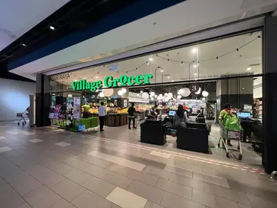 a large grocery store with people walking in front of it at Connected train 1 Bedroom ABOVE MALL-16 in Kuala Lumpur