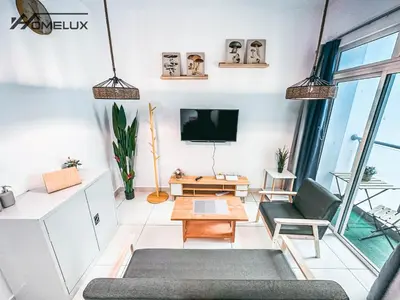 a living room with a tv and a couch at TR Residence WTC Titiwangsa Monorail MRT Station KLCC HKL IJM Bukit Bintang in Kuala Lumpur