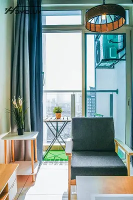 a living room with a couch and a large window at TR Residence WTC Titiwangsa Monorail MRT Station KLCC HKL IJM Bukit Bintang in Kuala Lumpur
