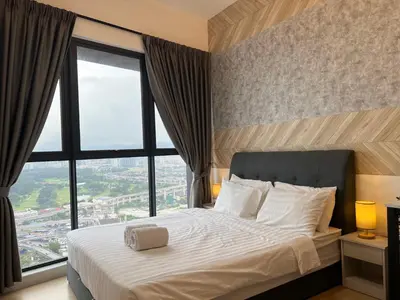 a bedroom with a large bed with a large window at Infini Suites@ Continew Residence KL in Kuala Lumpur