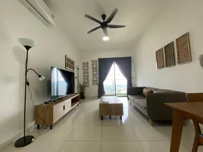 a living room with a couch and a ceiling fan at Infini Suites@ Continew Residence KL in Kuala Lumpur