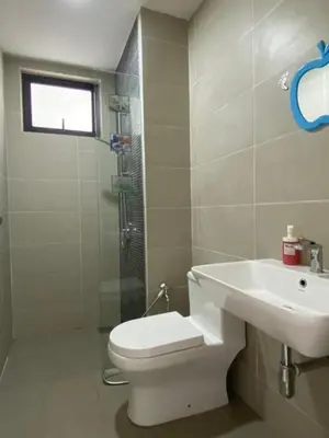a bathroom with a toilet and a sink and a shower at Infini Suites@ Continew Residence KL in Kuala Lumpur