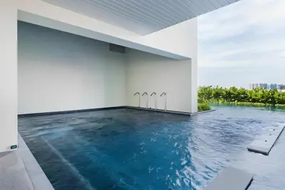 a swimming pool in the middle of a building at UNA Serviced Apartment, Sunway Velocity Kuala Lumpur in Kuala Lumpur