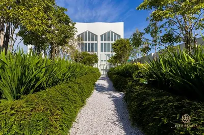 a building with a pathway in front of a building at UNA Serviced Apartment, Sunway Velocity Kuala Lumpur in Kuala Lumpur