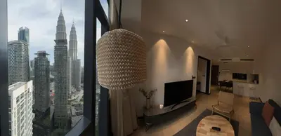 a living room with a large chandelier in a building at Atmoods - Star Residence in Kuala Lumpur