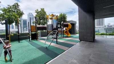 a child playing on a playground in a building at Majestic Apartment KLCC in Kuala Lumpur
