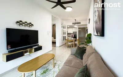 a living room with a couch and a tv at Legasi Kampung Baru by Airhost in Kuala Lumpur