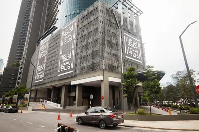 a car parked in front of a building at Legasi Kampung Baru by Airhost in Kuala Lumpur