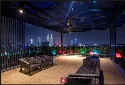 a balcony with two benches and a view of a city at EXPRESSIONZ by GSuites in Kuala Lumpur