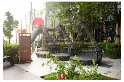 a group of benches in a park with trees at EXPRESSIONZ by GSuites in Kuala Lumpur