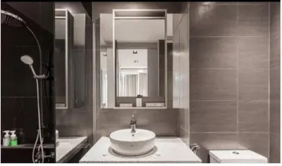 a bathroom with a sink and a mirror at EXPRESSIONZ by GSuites in Kuala Lumpur