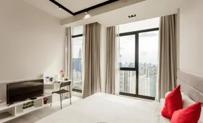 a white room with a television and a large window at EXPRESSIONZ by GSuites in Kuala Lumpur