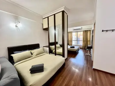 a bedroom with a large bed with a mirror at Casa Mutiara Apartments by Moonlight in Kuala Lumpur