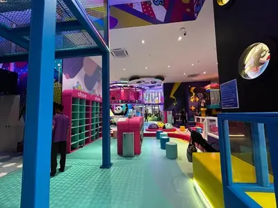 a room with a play room with a clown arcade at 8 Kia Peng Residences by Times 8 in Kuala Lumpur