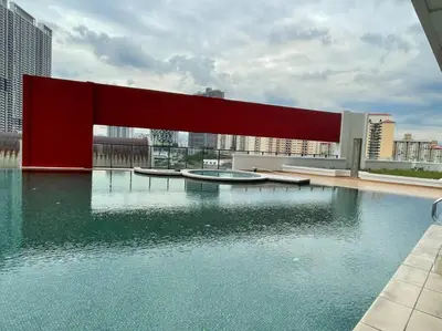 a building with a pool of water on top of it at Staycation with Private Jacuzzi @ KL Downtown 1711 in Kuala Lumpur