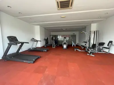a gym with several exercise equipment in a room at Staycation with Private Jacuzzi @ KL Downtown 1711 in Kuala Lumpur