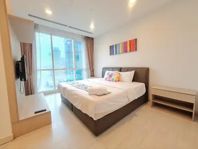 a bedroom with a large bed and a window at KLCC Binjai 8 Premium Soho Apartment by Sarah's Lodge in Kuala Lumpur