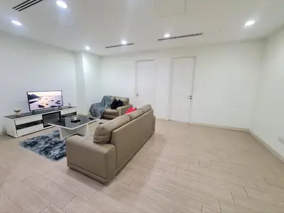a living room with a couch and a table at KLCC Binjai 8 Premium Soho Apartment by Sarah's Lodge in Kuala Lumpur