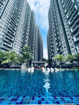 a large swimming pool in front of tall buildings at Kama Homestay @Wangsa Maju in Kuala Lumpur