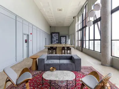 a room with a couch and chairs and a table at Scarletz Suites Kuala Lumpur, Five Senses in Kuala Lumpur