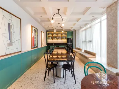 a dining room with a table and chairs at Scarletz Suites Kuala Lumpur, Five Senses in Kuala Lumpur