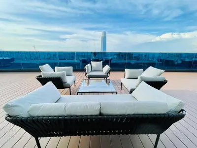 a couch sitting on top of a roof at Eaton residences KLCC m@h in Kuala Lumpur