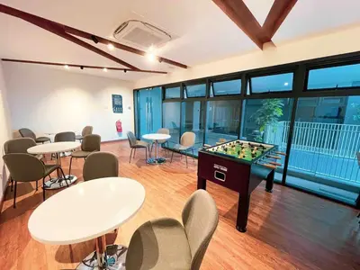 a room with a foosball table and chairs at PARC 3 in Cheras, #Sunway Velocity #IKEA #TRX in Kuala Lumpur