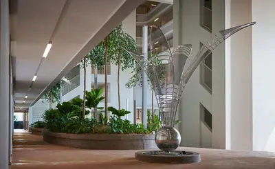 a vase on a table in a hallway with plants at PARC 3 in Cheras, #Sunway Velocity #IKEA #TRX in Kuala Lumpur