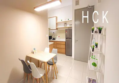 a kitchen and dining room with a table and chairs at Titiwangsa Core at TR Residence by HCK in Kuala Lumpur
