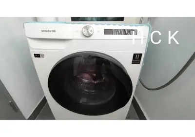 a washing machine with its door open in a room at Titiwangsa Core at TR Residence by HCK in Kuala Lumpur
