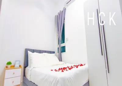 a bedroom with a bed with red hearts on it at Titiwangsa Core at TR Residence by HCK in Kuala Lumpur