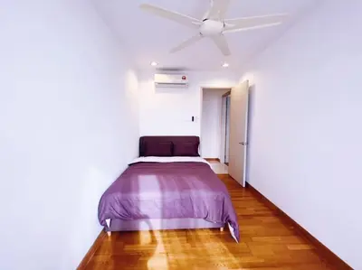 a bed in a white room with a ceiling fan at [PROMO]Connected train 2 Bedrooms - Above Mall(25) in Kuala Lumpur