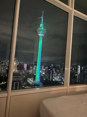 a room with a view of the seoul tower at night at near klcc vortex suites by PLUS POIN in Kuala Lumpur