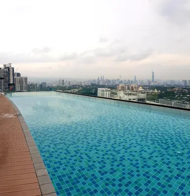 a large swimming pool on the roof of a building at Mont Kiara 163 Mall (The Ooak) Private Room in Kuala Lumpur