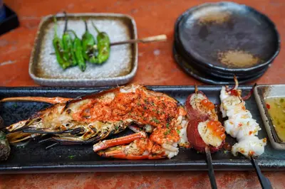 a tray of food with a lobster and other foods at Mont Kiara 163 Mall (The Ooak) Private Room in Kuala Lumpur