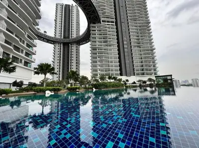 a swimming pool in front of two tall buildings at Datum Jelatek linked LRT and MALL with Netflix -Disney -WashDryer in Kuala Lumpur
