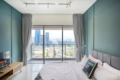 a bedroom with a bed and a large window at Continew Residence KL CoBNB in Kuala Lumpur