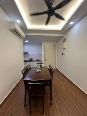 a dining room with a table and a ceiling fan at KLVIEW LEGASI KG BARU in Kuala Lumpur
