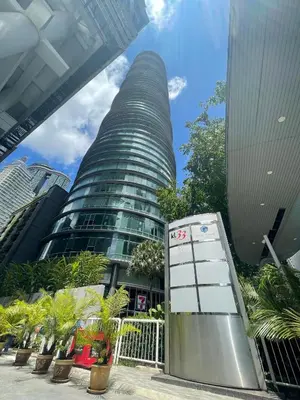 a tall building with a sign in front of it at KLCC vortex apartment suites Kuala Lumpur in Kuala Lumpur