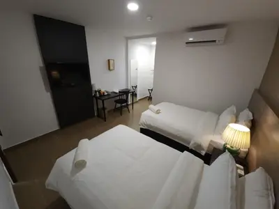 a view of a hotel room with two beds at Yu Hotel Chinatown in Kuala Lumpur