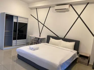 a bedroom with a large white bed and a window at Arte plus by Nicestay in Kuala Lumpur