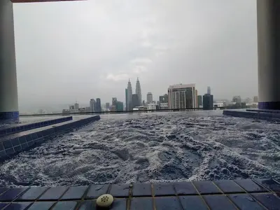 a pool of water on the roof of a building at Colony ( Wisma Infinitum ) in Kuala Lumpur