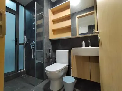 a bathroom with a toilet and a shower and a sink at Colony ( Wisma Infinitum ) in Kuala Lumpur