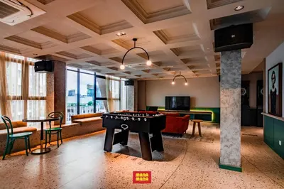 a living room with a pool table and a game room at Scarletz Mana-Mana Suites KLCC in Kuala Lumpur
