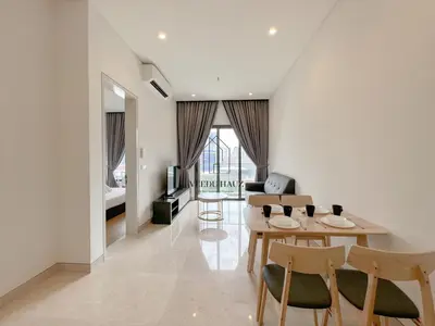 a living room with a table and chairs at Lucentia Residences BBCC at Lalaport Kuala Lumpur by Veedu Hauz in Kuala Lumpur