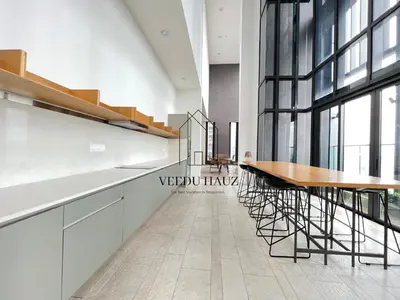 a dining room with a table and some chairs at Lucentia Residences BBCC at Lalaport Kuala Lumpur by Veedu Hauz in Kuala Lumpur