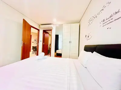 a bedroom with a large white bed in it at VortexLuxApartman KLCC, kuala lampur city in Kuala Lumpur
