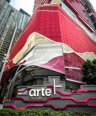 a building with a sign on the side of it at Arte Plus AMPANG by Zzzayn in Batu Empat
