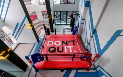a red bench with a sign that says dont quit at Arte Plus AMPANG by Zzzayn in Batu Empat